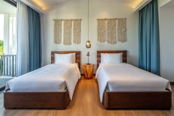 Imagen de la habitación del Hotel New World Phu Quoc Resort. Foto 16