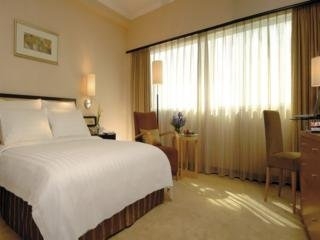 Imagen de la habitación del Hotel New World Shenyang. Foto 3