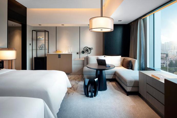 Imagen de la habitación del Hotel New World Shenyang Hotel. Foto 14