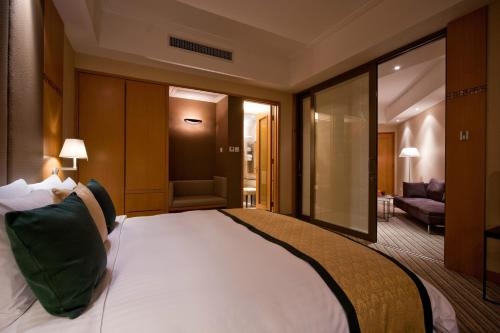 Imagen de la habitación del Hotel New World Shunde. Foto 4