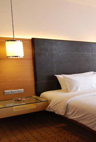 Imagen de la habitación del Hotel New World Suites. Foto 3