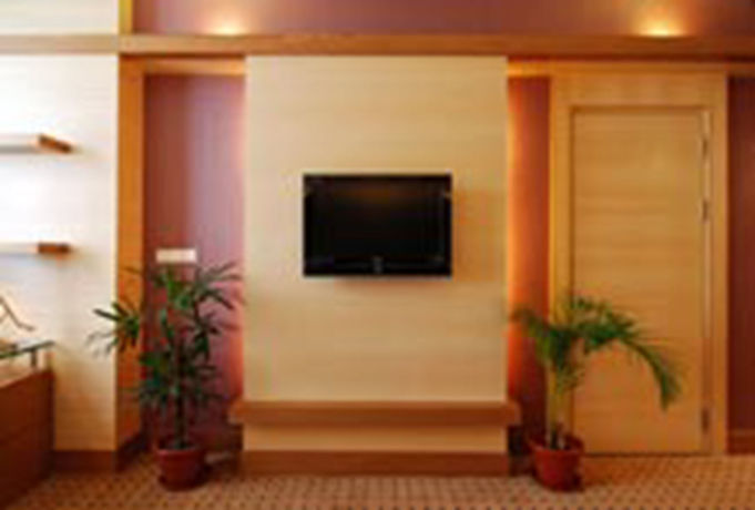 Imagen de la habitación del Hotel New World Suites. Foto 4