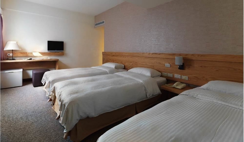 Imagen de la habitación del Hotel New World, Taipei. Foto 3