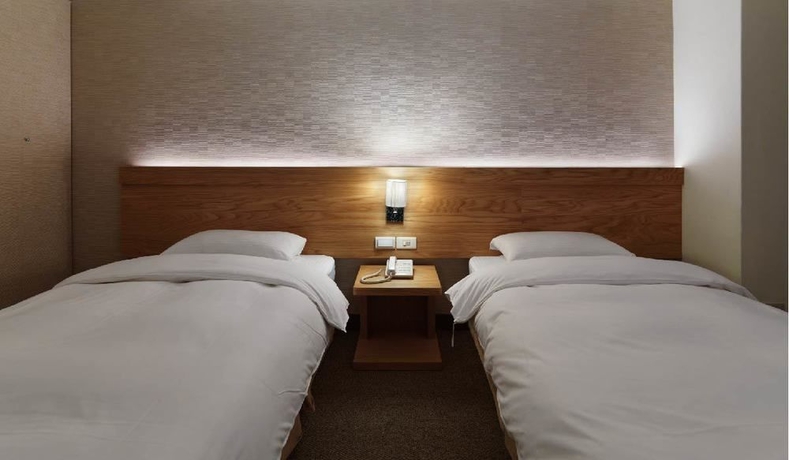 Imagen de la habitación del Hotel New World, Taipei. Foto 4