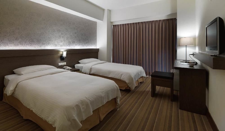 Imagen de la habitación del Hotel New World, Taipei. Foto 6