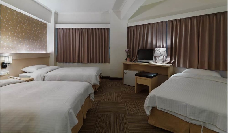 Imagen de la habitación del Hotel New World, Taipei. Foto 7