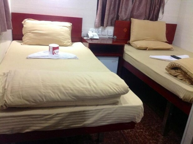 Imagen de la habitación del Hotel New Yan Yan Guest House. Foto 17