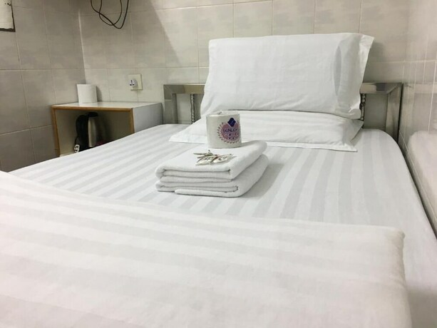 Imagen de la habitación del Hotel New Yan Yan Guest House. Foto 18