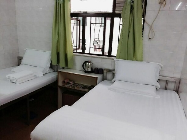 Imagen de la habitación del Hotel New Yan Yan Guest House. Foto 20