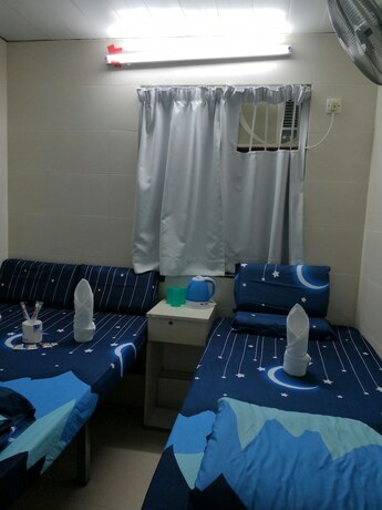 Imagen de la habitación del Hotel New Yan Yan Guest House. Foto 22