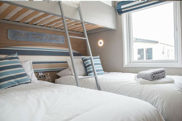 Imagen de la habitación del Hotel Newperran Holiday Park. Foto 19