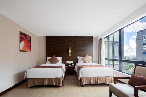 Imagen de la habitación del Hotel Newyantai Hainan. Foto 15