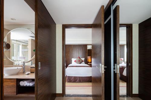 Imagen de la habitación del Hotel Newyantai Hainan. Foto 18