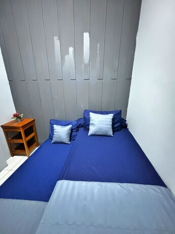 Imagen de la habitación del Hotel NgeKost harian. Foto 18