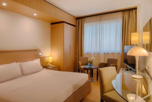 Imagen de la habitación del Hotel Nh Bologna Villanova. Foto 11