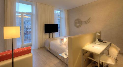 Imagen de la habitación del Hotel Nh Collection Porto Batalha. Foto 17