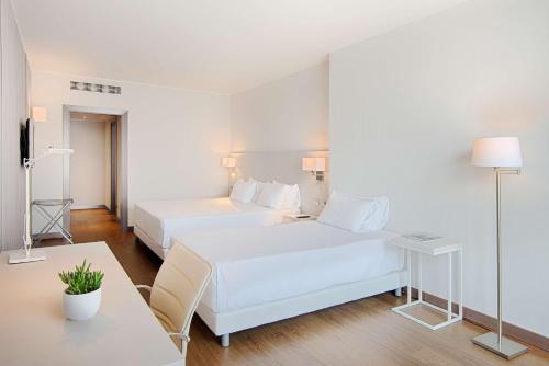 Imagen de la habitación del Hotel Nh Lecco Pontevecchio. Foto 12