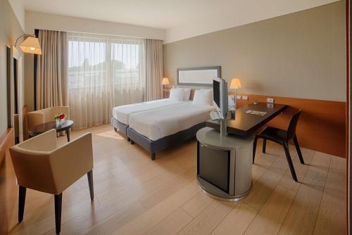 Imagen de la habitación del Hotel Nh Linate. Foto 19