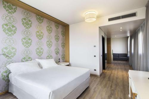 Imagen de la habitación del Hotel Nh Milano Fiera. Foto 11