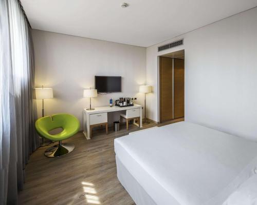 Imagen de la habitación del Hotel Nh Milano Fiera. Foto 19