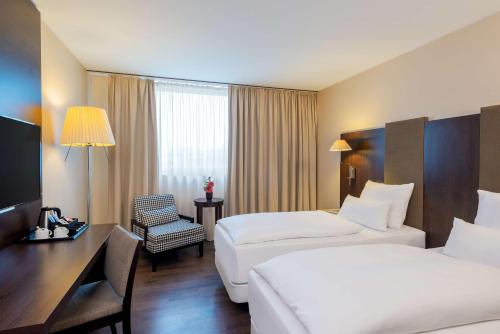 Imagen de la habitación del Hotel Nh Stuttgart Airport. Foto 20