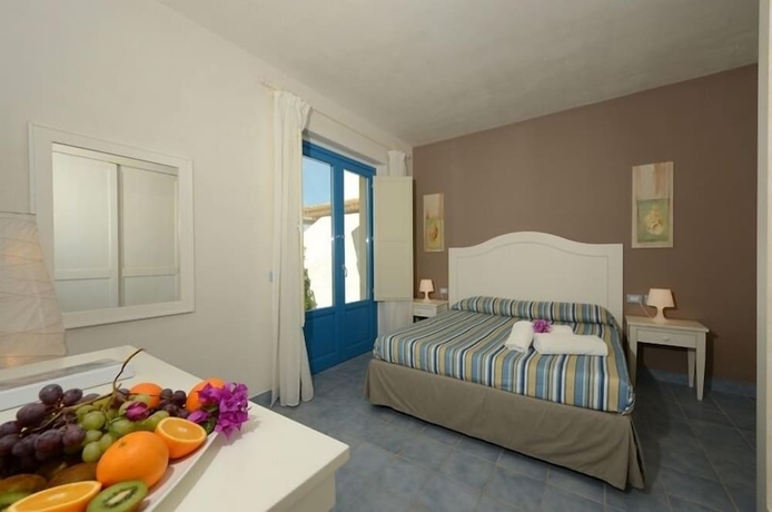 Imagen de la habitación del Hotel Nicolaus Club Borgo Rio Favara Resort. Foto 9