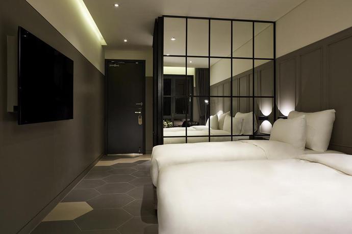 Imagen de la habitación del Hotel Nine Brick Hotel. Foto 18