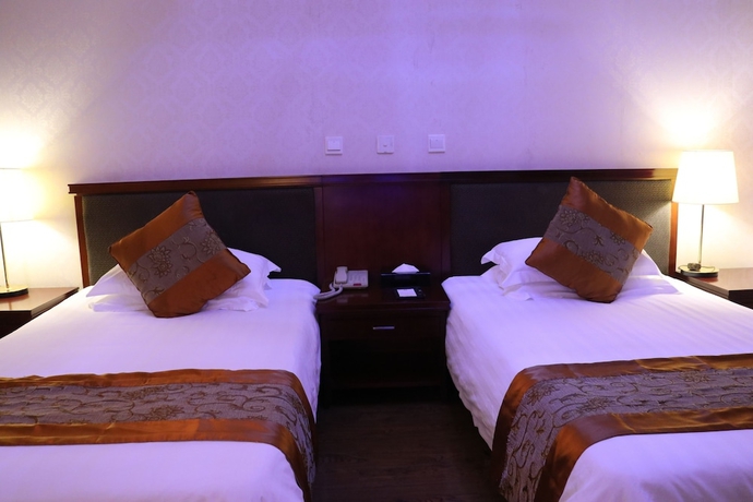 Imagen de la habitación del Hotel Ninghai New Century. Foto 9