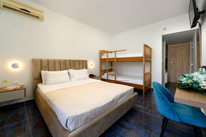 Imagen de la habitación del Hotel Ninos Grand Beach and Resort. Foto 10