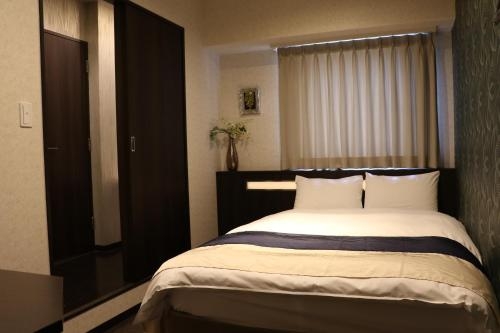 Imagen de la habitación del Hotel Nipponbashi Luxe. Foto 6