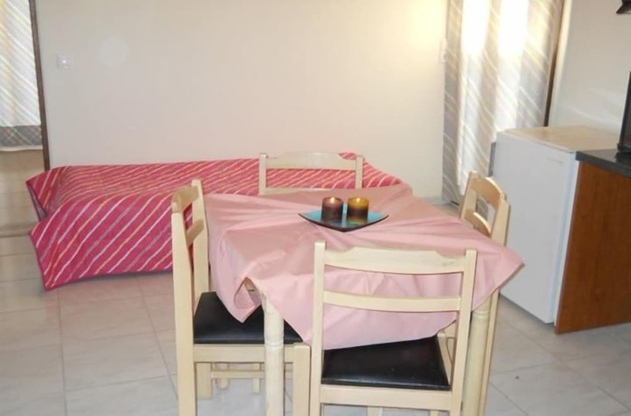 Imagen de la habitación del Hotel Niriedes Dionyssos Village. Foto 19
