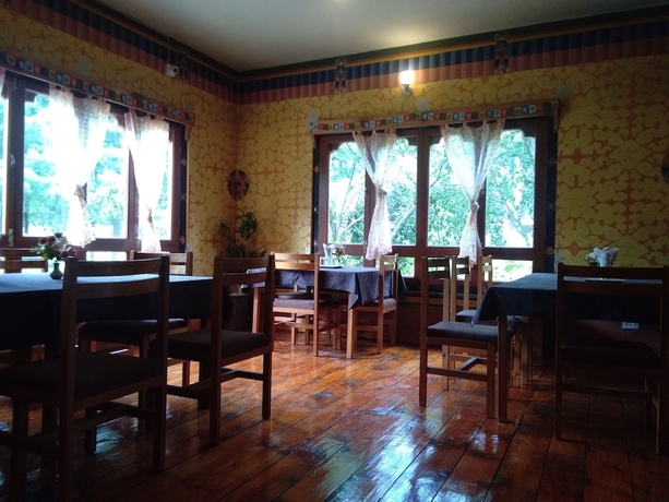 Imagen del bar/restaurante del Hotel Nirvana Lodge. Foto 6