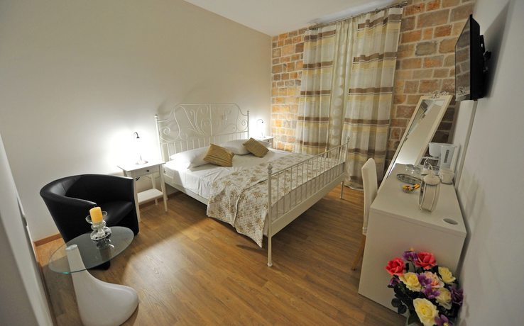 Imagen de la habitación del Hotel Nirvana Luxury Rooms. Foto 9