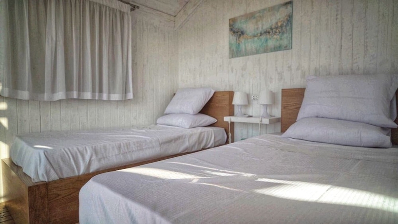 Imagen de la habitación del Hotel Nirvana Wellness Huts - White bay. Foto 12