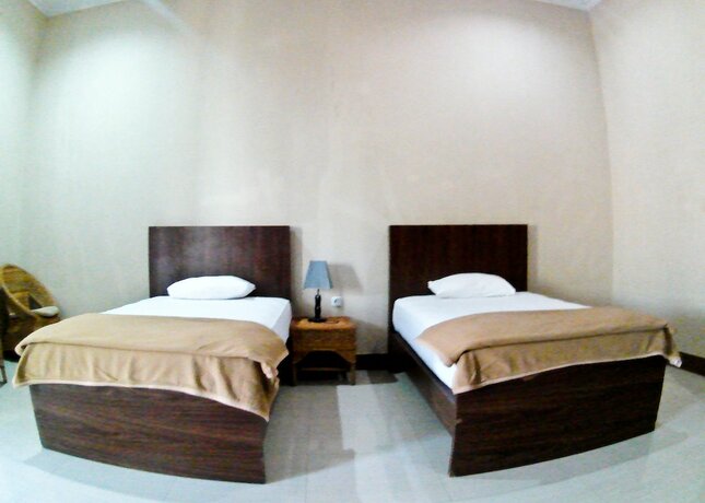 Imagen de la habitación del Hotel Nirwana Buton Villa. Foto 20