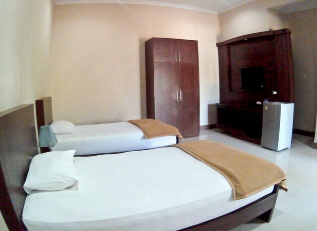Imagen de la habitación del Hotel Nirwana Buton Villa. Foto 23