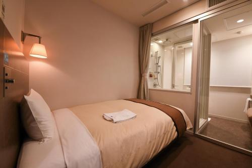 Imagen de la habitación del Hotel Nishitetsu Inn Kamata. Foto 7