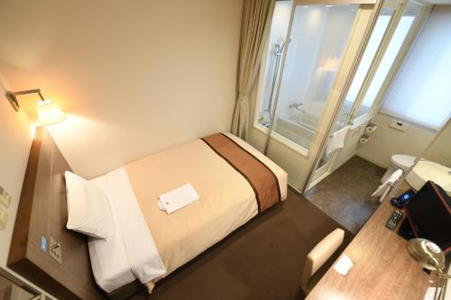 Imagen de la habitación del Hotel Nishitetsu Inn Kamata. Foto 10