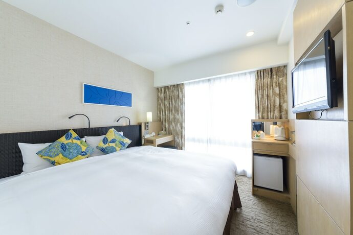 Imagen de la habitación del Hotel Nishitetsu Resort Inn Naha. Foto 16