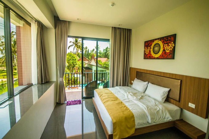 Imagen de la habitación del Hotel Nitchanan Villa. Foto 8