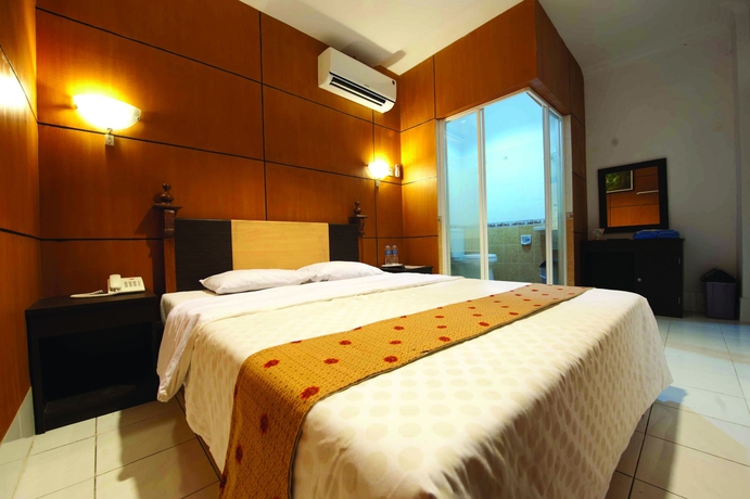 Imagen de la habitación del Hotel Nite And Day Semarang. Foto 12