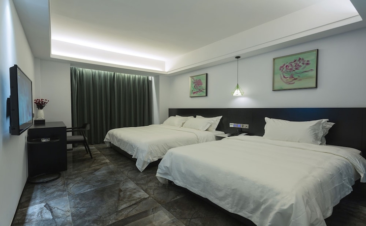 Imagen de la habitación del Hotel Niuguanjia Modern Guest House. Foto 2