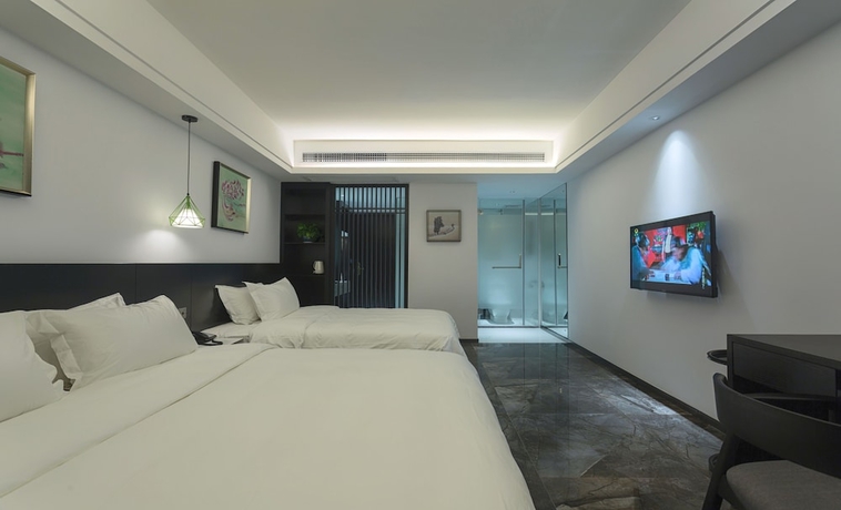 Imagen de la habitación del Hotel Niuguanjia Modern Guest House. Foto 3