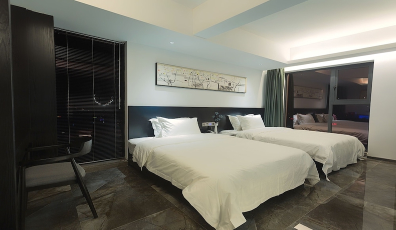 Imagen de la habitación del Hotel Niuguanjia Modern Guest House. Foto 4