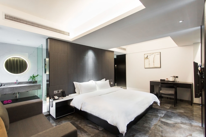 Imagen de la habitación del Hotel Niuguanjia Modern Guest House. Foto 6
