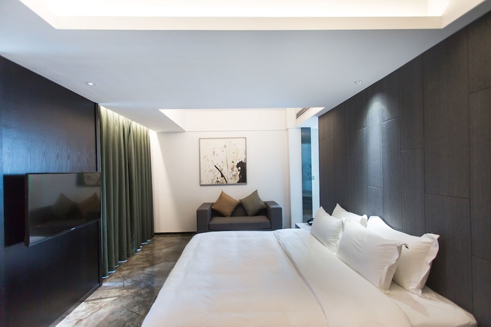 Imagen de la habitación del Hotel Niuguanjia Modern Guest House. Foto 7