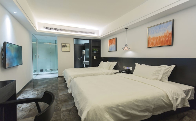 Imagen de la habitación del Hotel Niuguanjia Modern Guest House. Foto 10
