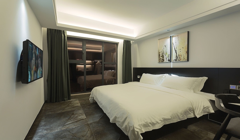 Imagen de la habitación del Hotel Niuguanjia Modern Guest House. Foto 14