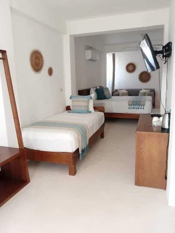 Imagen de la habitación del Hotel Noah Beach and Suites. Foto 12