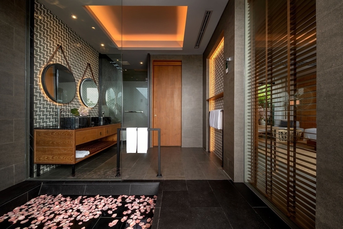 Imagen de la habitación del Hotel Noku Phuket. Foto 18